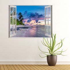 Fen&ecirc;tre avec vue sur une plage au coucher de soleil